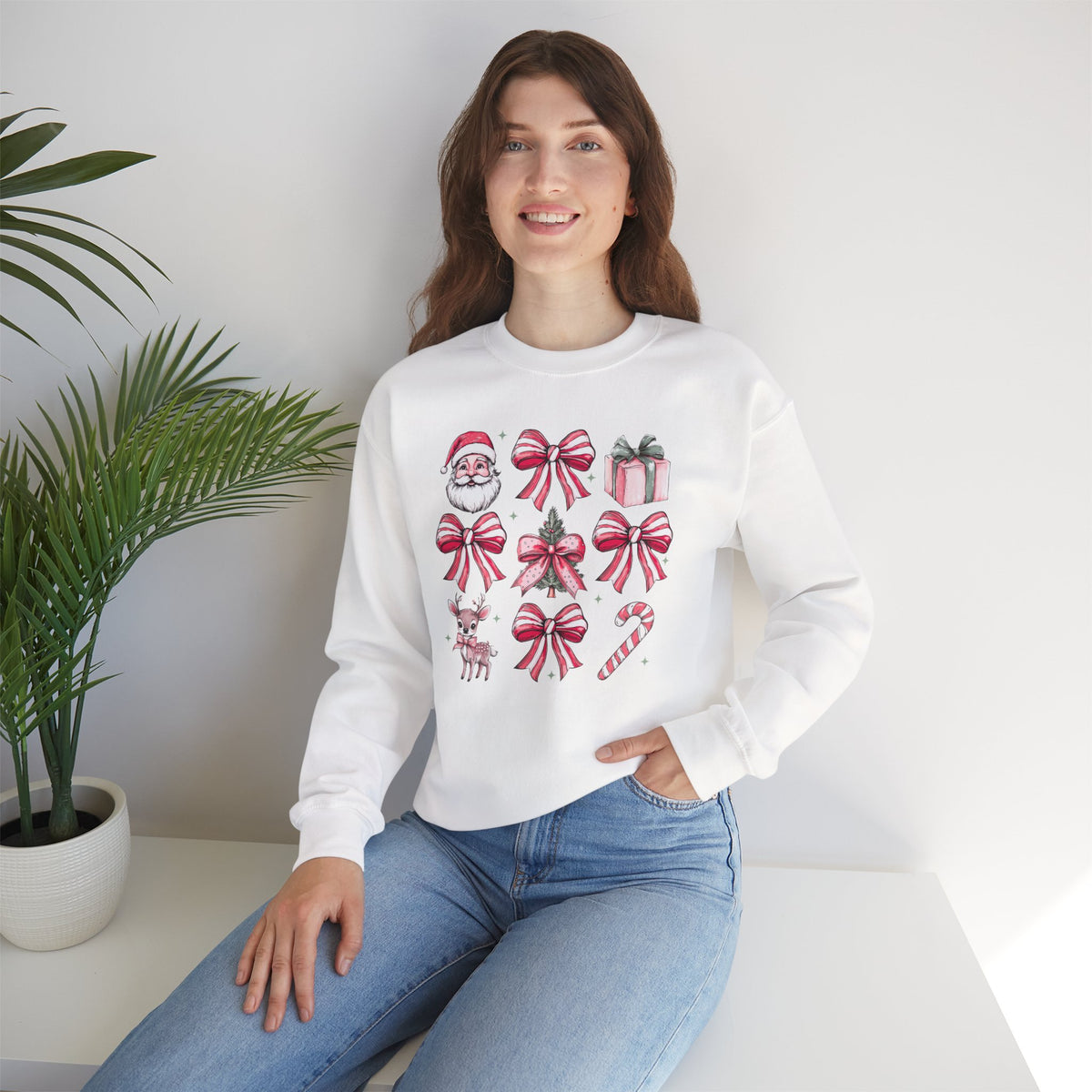 Pink Christmas bows and icons Crewneck Sweatshirt | Santa, reindeer, candy cane